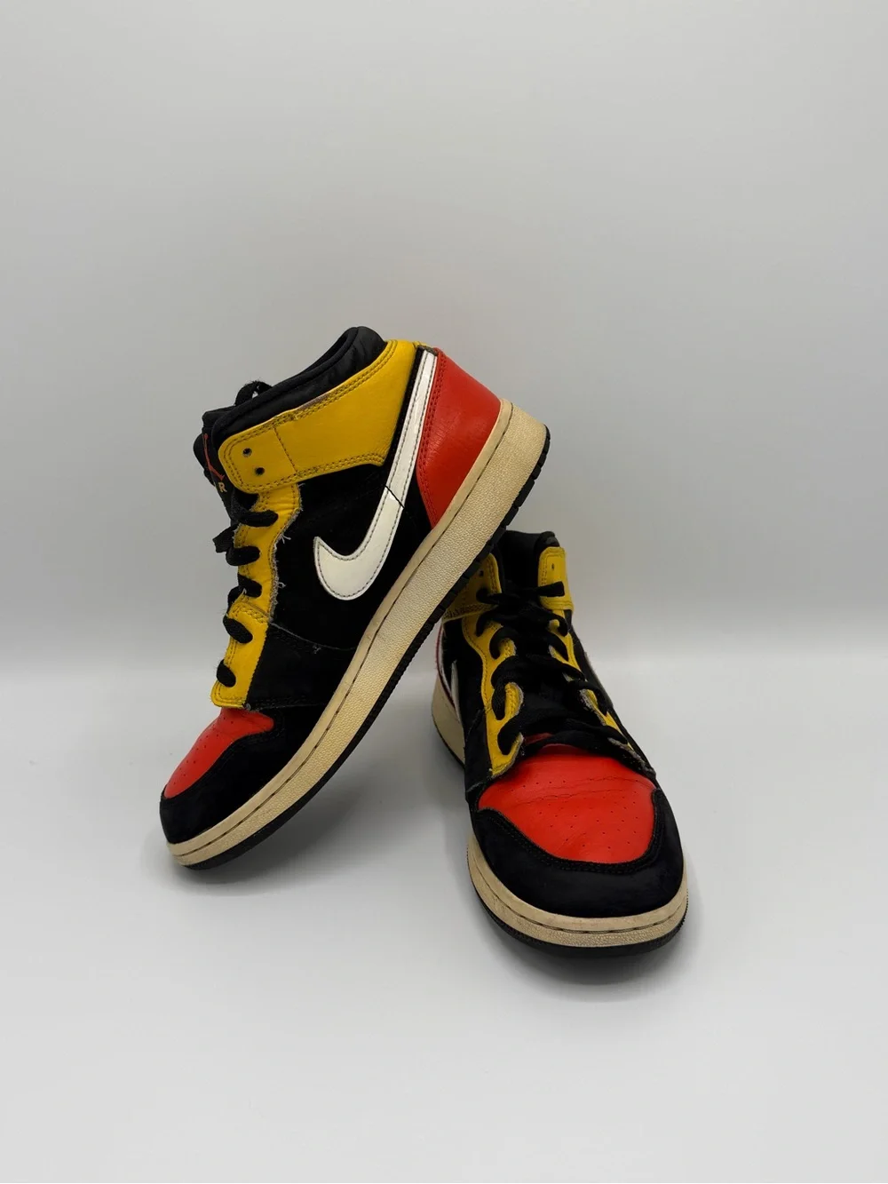 Jordan High-Top Sneakers in Black, Red & Yellow